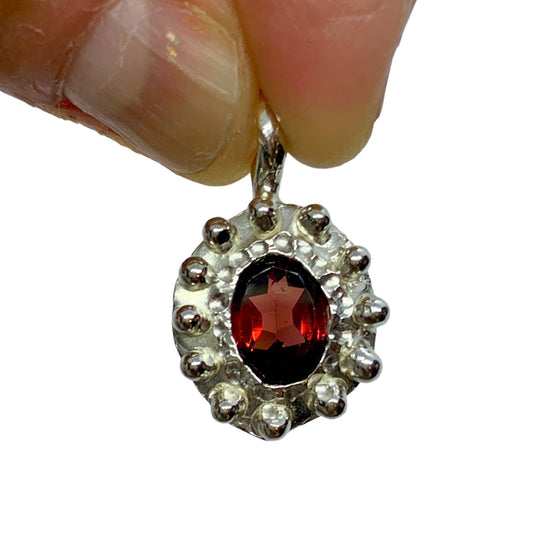 The Merah pendant, which is bahasa indonesia for red is made of sterling silver and features a red garnet stone. It comes with a 42cm silver chain. 