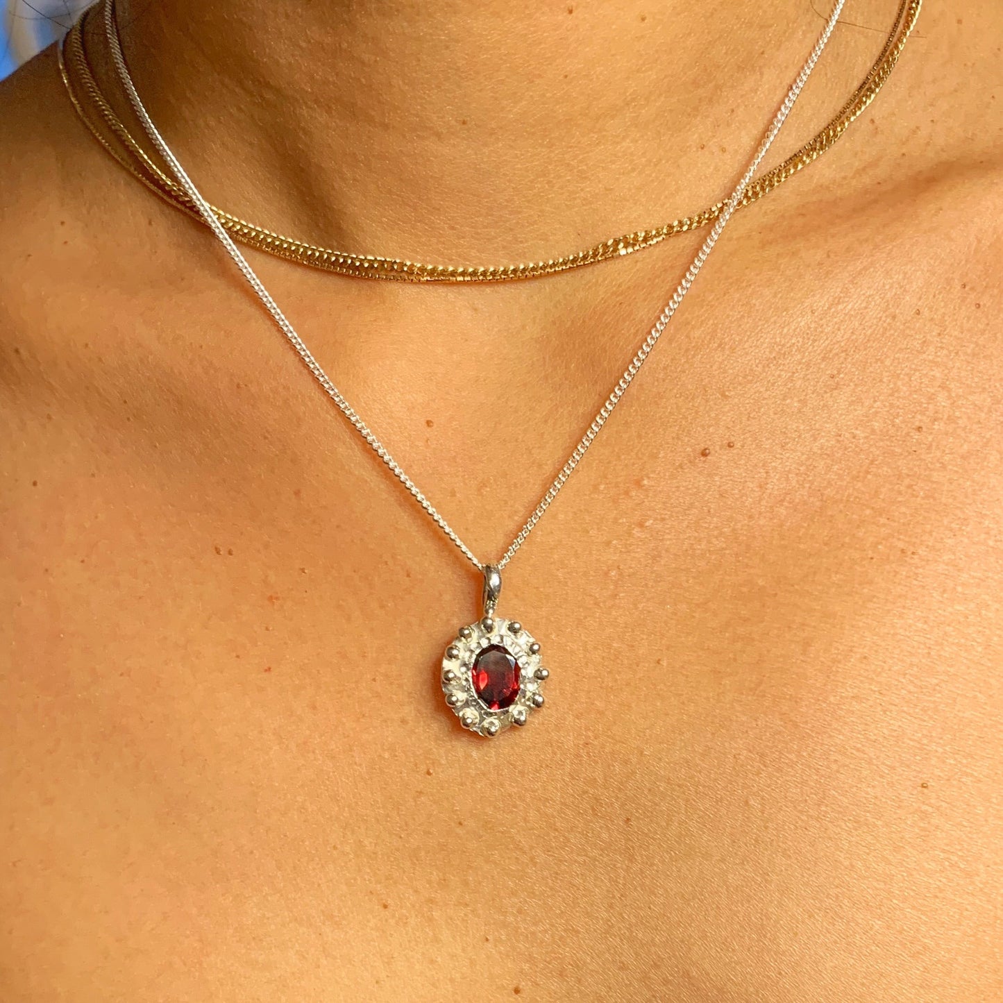 The Merah pendant, which is bahasa indonesia for red is made of sterling silver and features a red garnet stone. It comes with a 42cm silver chain. 