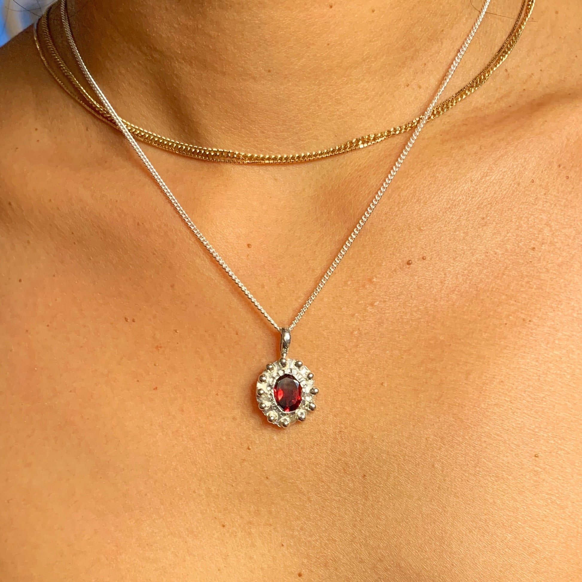 The Merah pendant, which is bahasa indonesia for red is made of sterling silver and features a red garnet stone. It comes with a 42cm silver chain. 