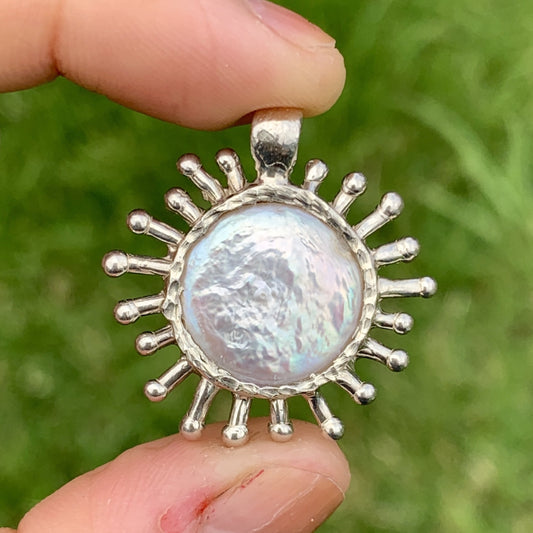 I started make the corona pendant right after the Covid-19 hits the world. It is a pendant with pearl stone surrounded by lots of spikes .