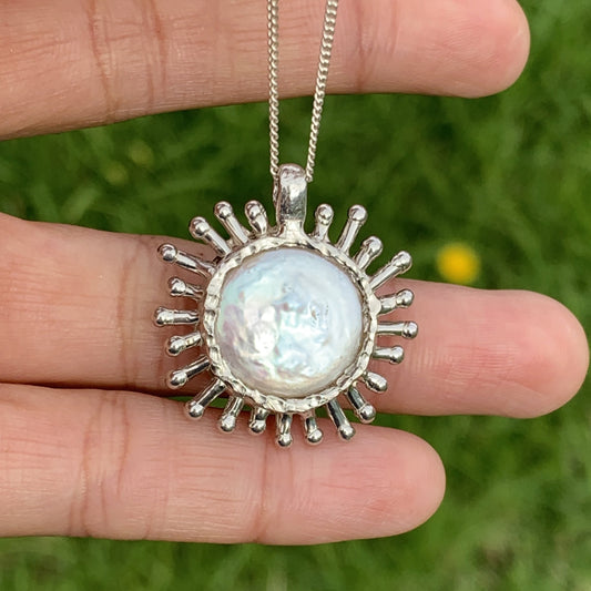 The corona pendant comes with the sterling silver chain. They look cute together. 