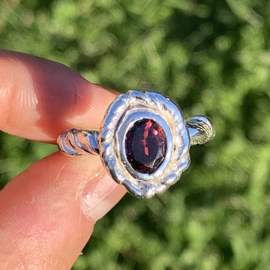 Twirly Ring is a sterling silver twirly band with pink tourmaline oval stone on it. Size J 1/2 or 5