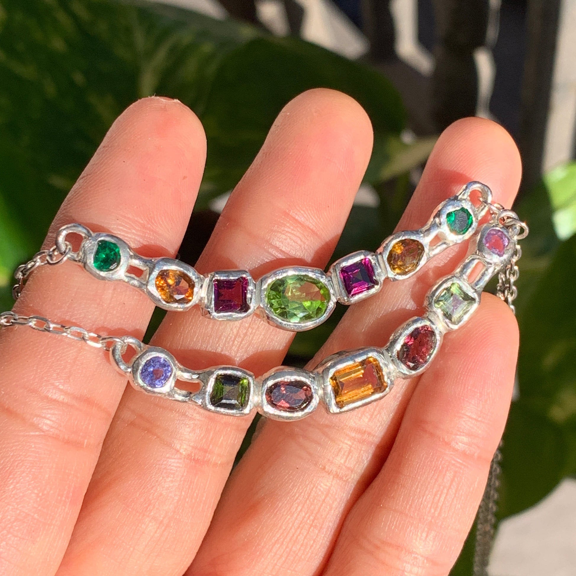Warna-Warni Necklace comes with several colours. The main middle stone is Green Peridot. The rest of the stone are purple tourmalines, yellow tourmalines, and synthetic stones for the green.  Edit alt text
