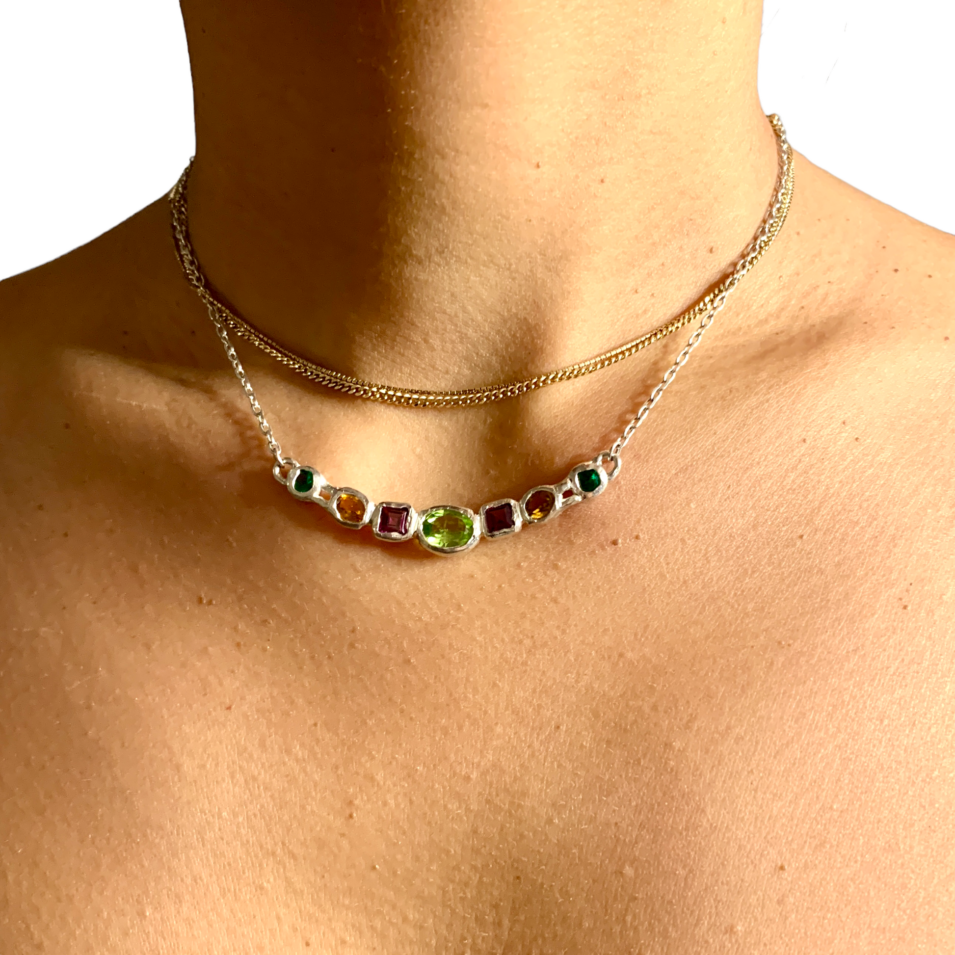 Warna-Warni Necklace comes with several colours. The main middle stone is Green Peridot. The rest of the stone are purple tourmalines, yellow tourmalines, and synthetic stones for the green. 